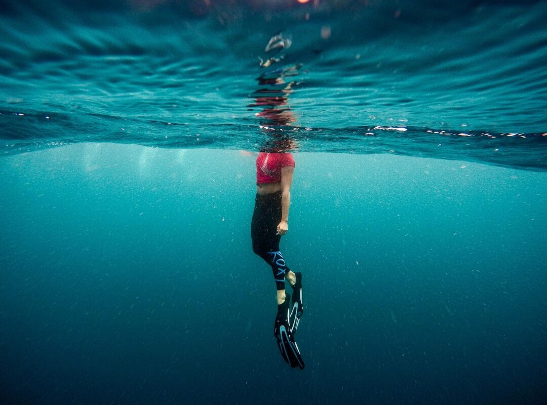 Snorkeller swimming at the surface in clear water