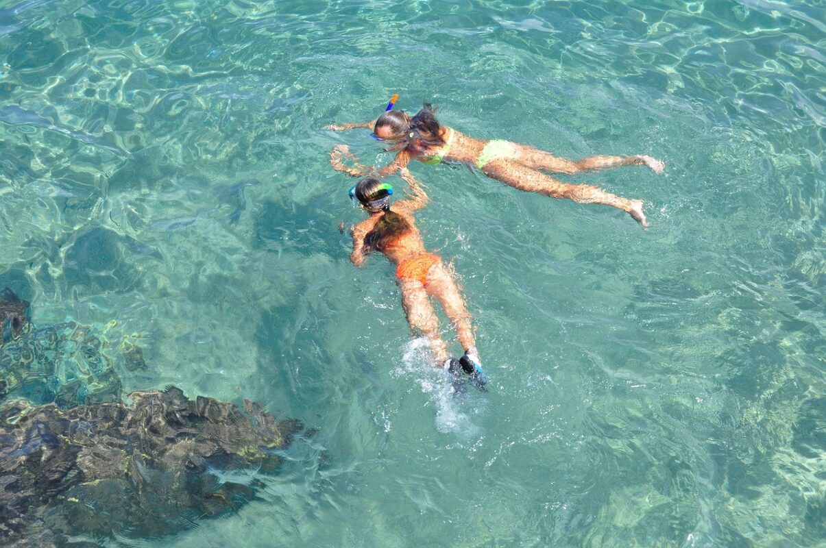 Anti-fog spray beside a snorkelling mask